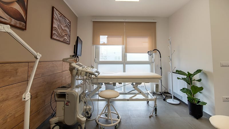 A stack of stapled multi-page forms on a desk with a pen resting across the top sheet.